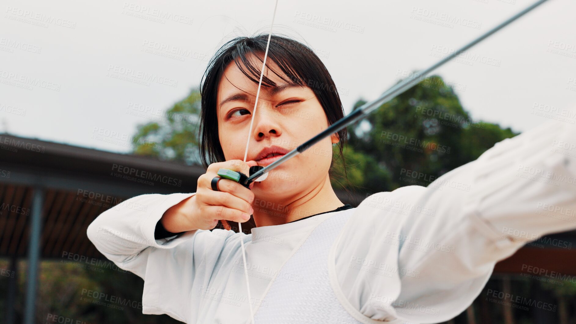 Buy stock photo Woman, archery and arrow at field with sport for shooting practice and training as athlete in Japan. Tournament, female person and setup recurve bow or equipment for challenge, game  and competition 