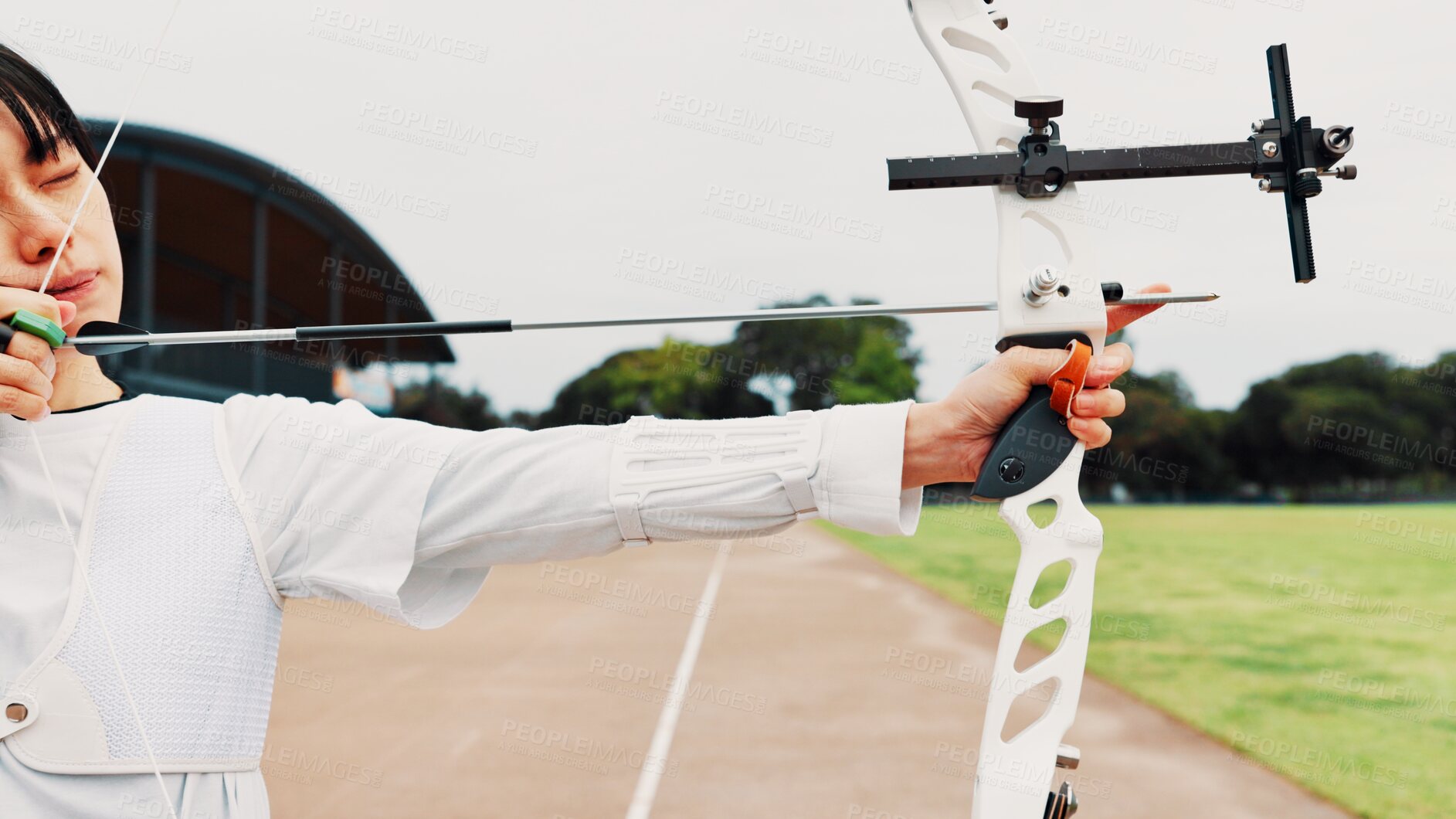 Buy stock photo Woman, archery and target at field with sport for shooting practice and training as athlete in Japan. Tournament, female person and aim with bow or equipment for challenge, game  and competition