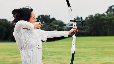 Buy stock photo Field, archer and woman with bow, aim and preparing for competition, equipment and outdoor for game. Contest, archery and practice from tournament, skills and challenge for person, training and Japan