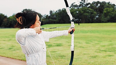 Buy stock photo Field, training and woman with bow, aim and preparing for competition, equipment and outdoor for game. Contest, athlete and practice from tournament, skills and challenge for person, archer and Japan