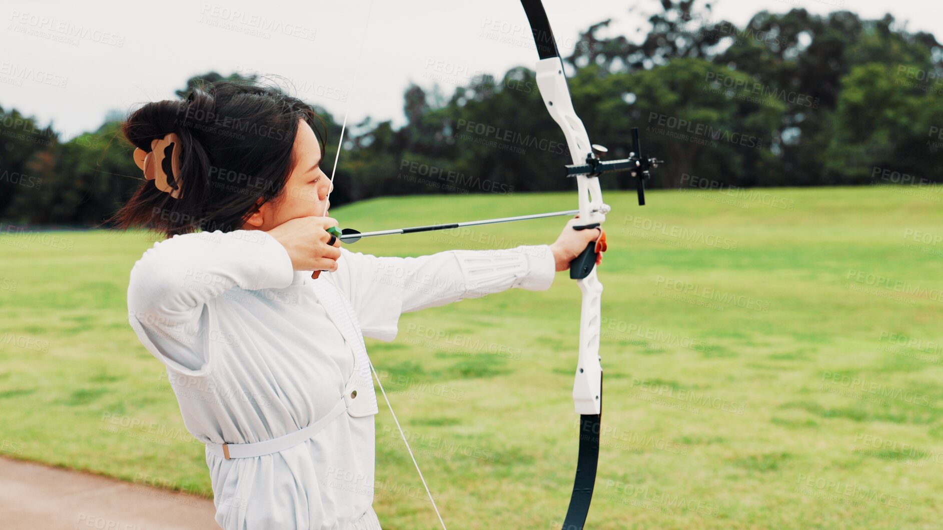 Buy stock photo Field, training and woman with bow, aim and preparing for competition, equipment and outdoor for game. Contest, athlete and practice from tournament, skills and challenge for person, archer and Japan