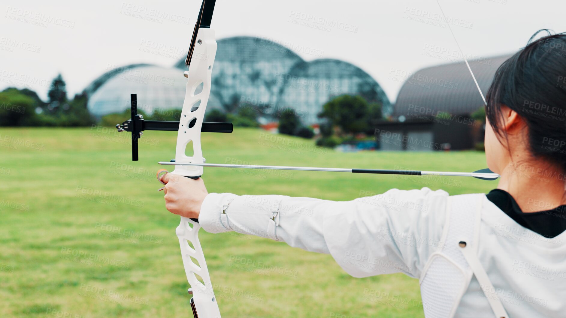 Buy stock photo Woman, archery and aim arrow in training at academy, outdoor exercise and practice skill. Female person, shooting challenge and field for competition games, learning and practice with tool in japan