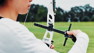 Buy stock photo Woman, archery and hands at field as sport for shooting practice and training as athlete in Japan. Closeup, female person and setup recurve bow or equipment for challenge, game and competition 