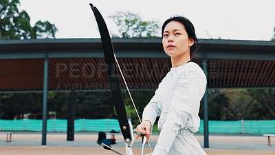 Buy stock photo Serious, athlete and woman with bow, sport and practice for challenge, training and equipment for game. Outdoor, skills and talent for archery, shooting and arrow for competition, archer and Japan