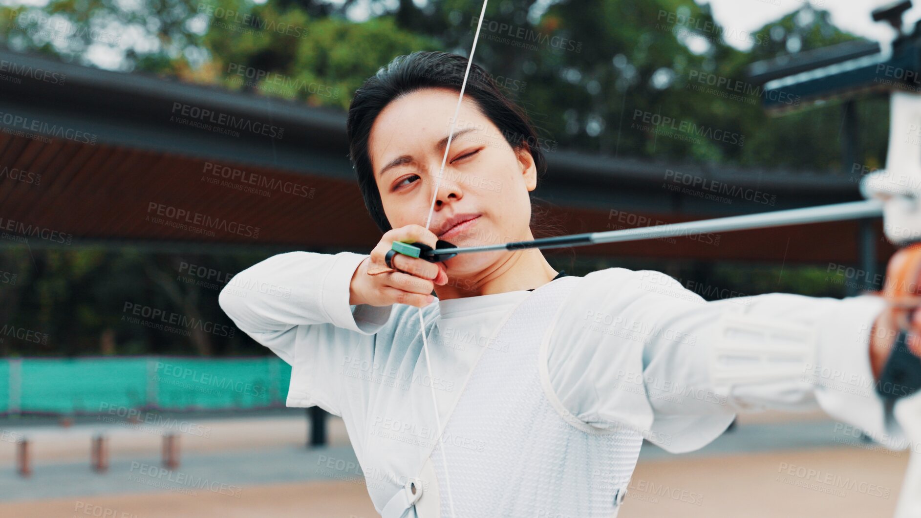 Buy stock photo Woman, aim and arrow for archery practice at academy, outdoor exercise and bow precision. Female person, shooting challenge and park for competition games, learning and sports with tool in japan