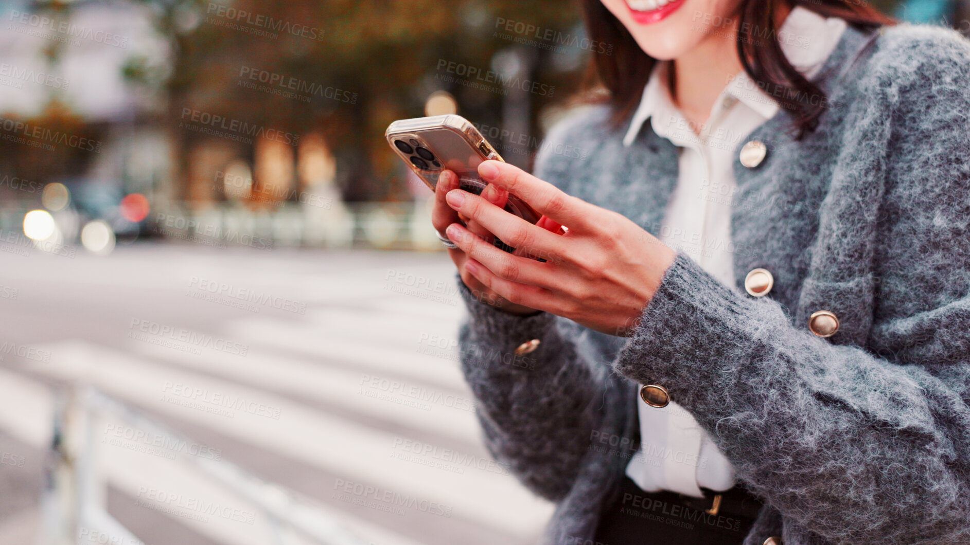 Buy stock photo Hands, phone and happy woman in city for travel, text or message on app on holiday in Japan. Smile, mobile and person on street for chat, communication and post on social media profile on internet