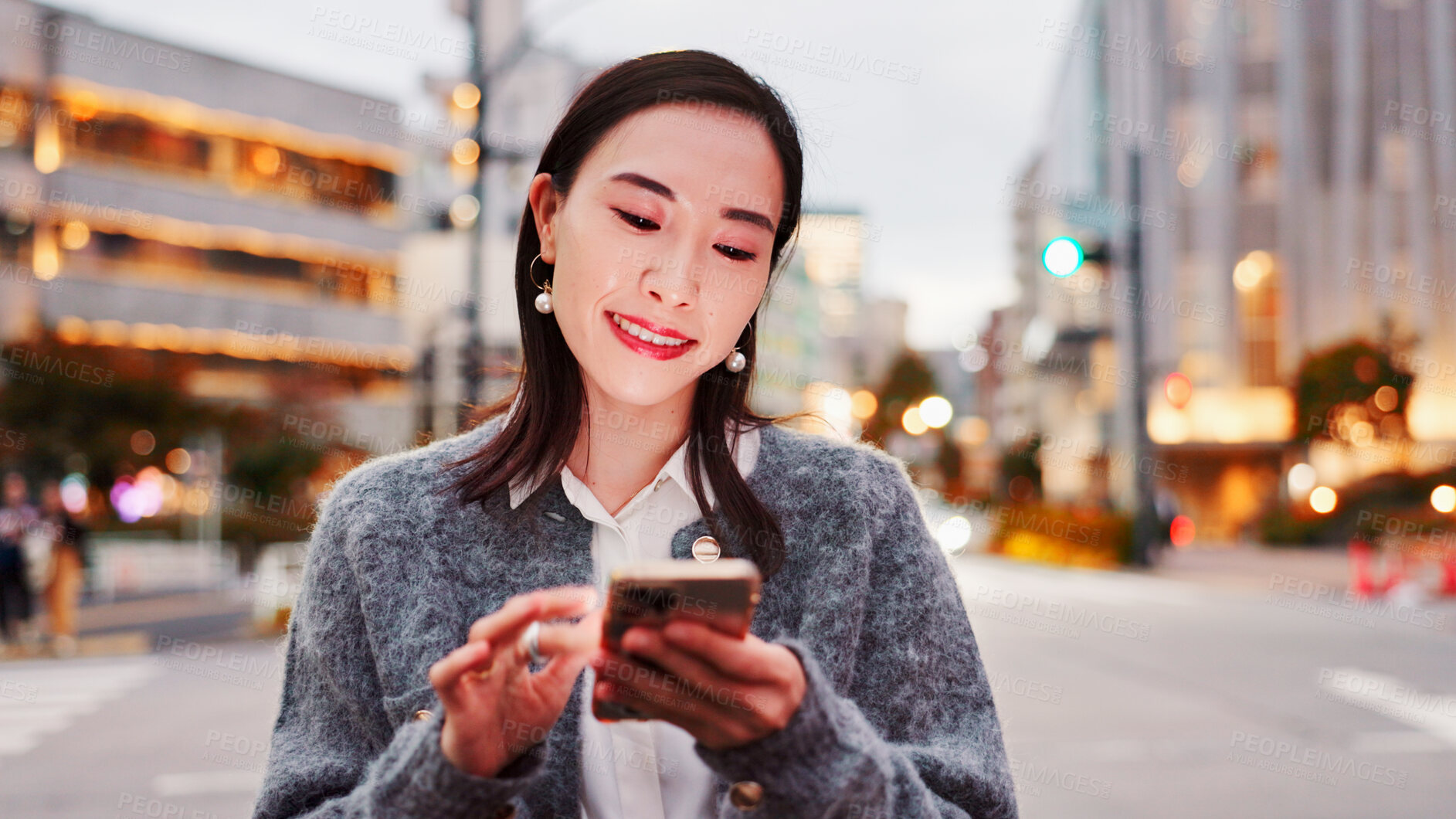 Buy stock photo Smile, woman and typing in city with phone, connection and online chat for morning commute. Smartphone, search and Japanese person on street with app for social media, communication and urban travel