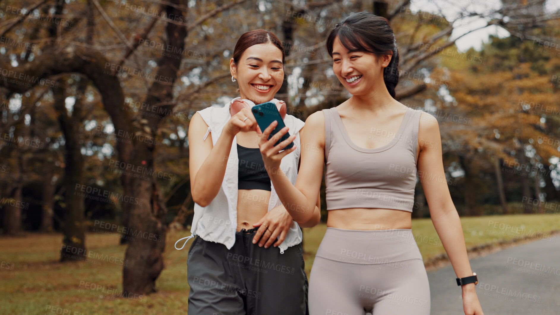 Buy stock photo Japan, smile and women with smartphone, exercise and typing with funny meme. Happiness, outdoor and friends with cellphone, fitness and technology for online reading, digital app and workout goals