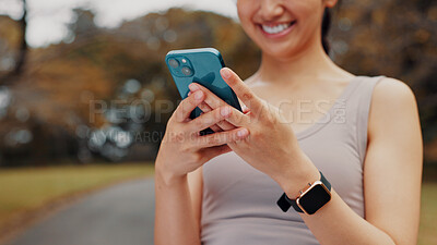 Buy stock photo Smile, woman and hands with phone for fitness outdoor, communication and research of exercise application. Happy, athlete and mobile for gym membership, training schedule and workout routine in Japan