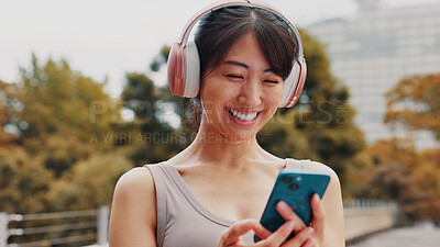 Buy stock photo Smile, woman and headphones with phone in city of listening to music, fitness podcast and social media. Athlete, mobile app and streaming radio for exercise routine, training website and Japan bridge