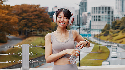 Buy stock photo Headphones, portrait and running with Japanese woman in city for health, streaming and fitness podcast. Wellness, cardio and training with person listening to music in Japan for workout and marathon