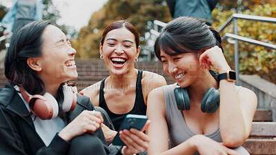 Buy stock photo Fitness, phone and friends laughing on stairs together with smile, relax and search on social media meme. Smartphone, sharing and happy Japanese women on steps checking mobile app for workout stats.