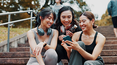 Buy stock photo Fitness, phone and group of women on stairs together with smile, relax and search on social media. Smartphone, sharing and happy Japanese girl friends on steps checking mobile app for workout stats.