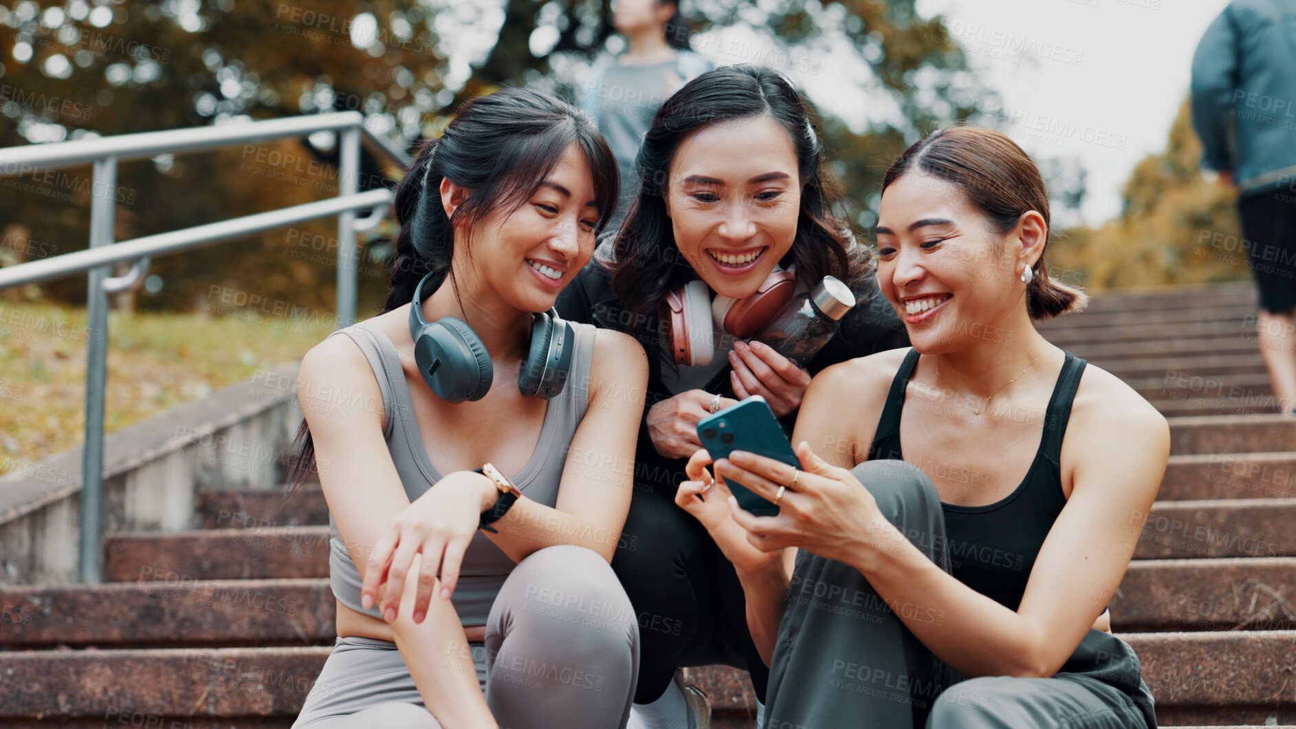 Buy stock photo Fitness, phone and group of women on stairs together with smile, relax and search on social media. Smartphone, sharing and happy Japanese girl friends on steps checking mobile app for workout stats.