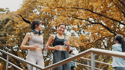 Buy stock photo Running, active and fitness for women, steps and friends with water, smile and exercise in morning. Outdoor, personal trainer and routine with Asian person, stairs and practice for marathon in Japan