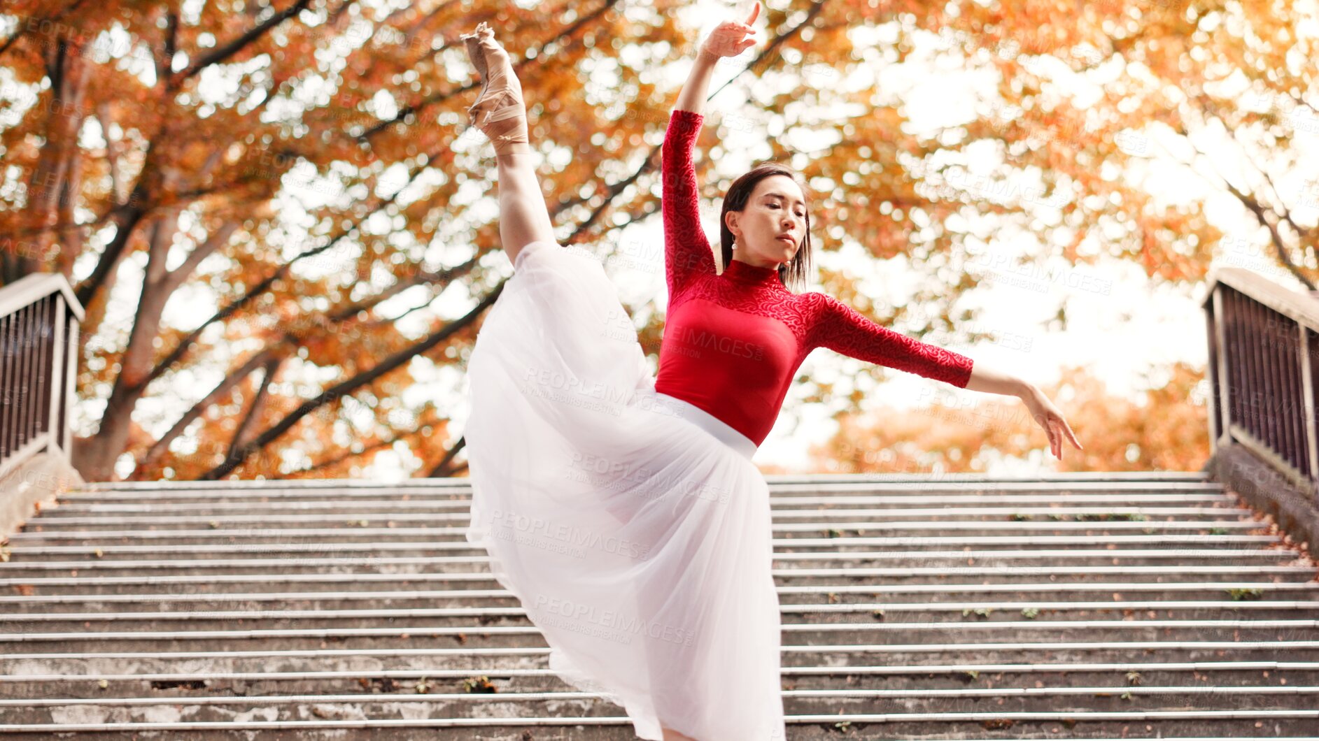 Buy stock photo Woman, stretching and ballet dancing in city, outdoor and practice performance for autumn art. Female person, professional dancer and creative talent in Japan, rehearsal and urban town for elegance