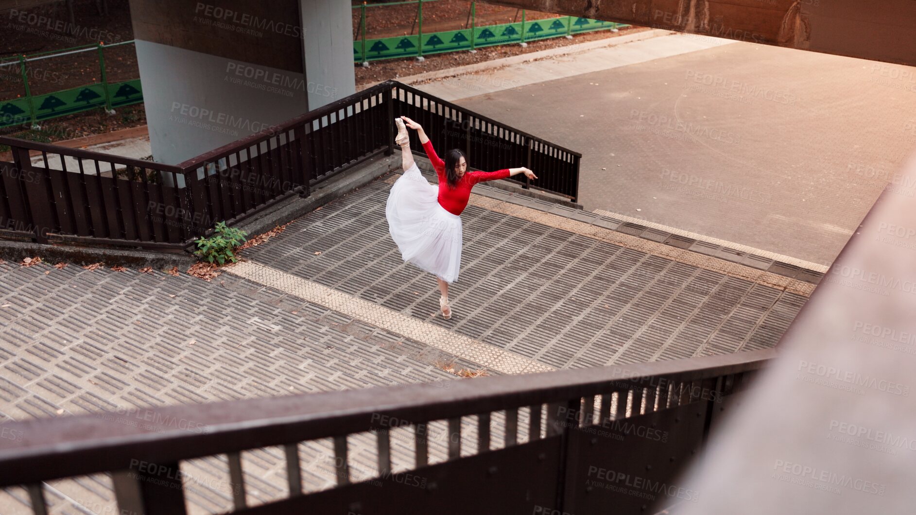 Buy stock photo Woman, stretching and ballet movement in city, outdoor and practice performance for art. Female person, professional dancer and creative talent in Japan, rehearsal and urban town for elegant training