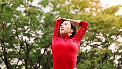 Buy stock photo Woman, dancing and stretching arms in park for warm up, fitness or ready for performance in nature. Person, dancer and rehearsal for concert, creative or recital with art, talent and prepare in Japan