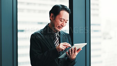 Buy stock photo Man, tablet and happy at window for business, research economy and good news in Japanese company. Finance investor, tech or reading in office for report, stock market update or investment opportunity