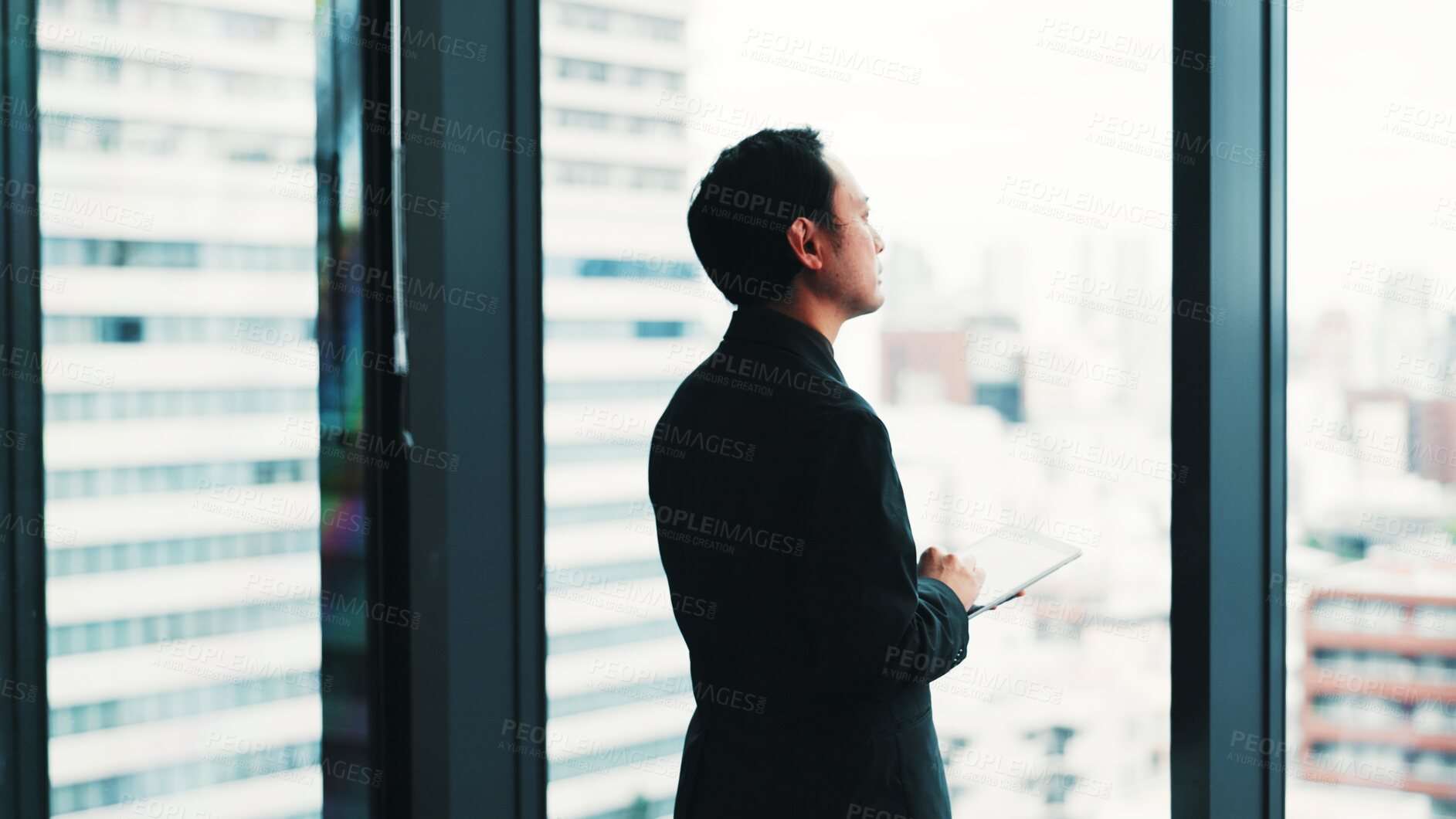 Buy stock photo Businessman, tablet or thinking at window for research, planning or reflection in Japanese company. Finance investor, tech or online in office for review, urban development idea or career opportunity