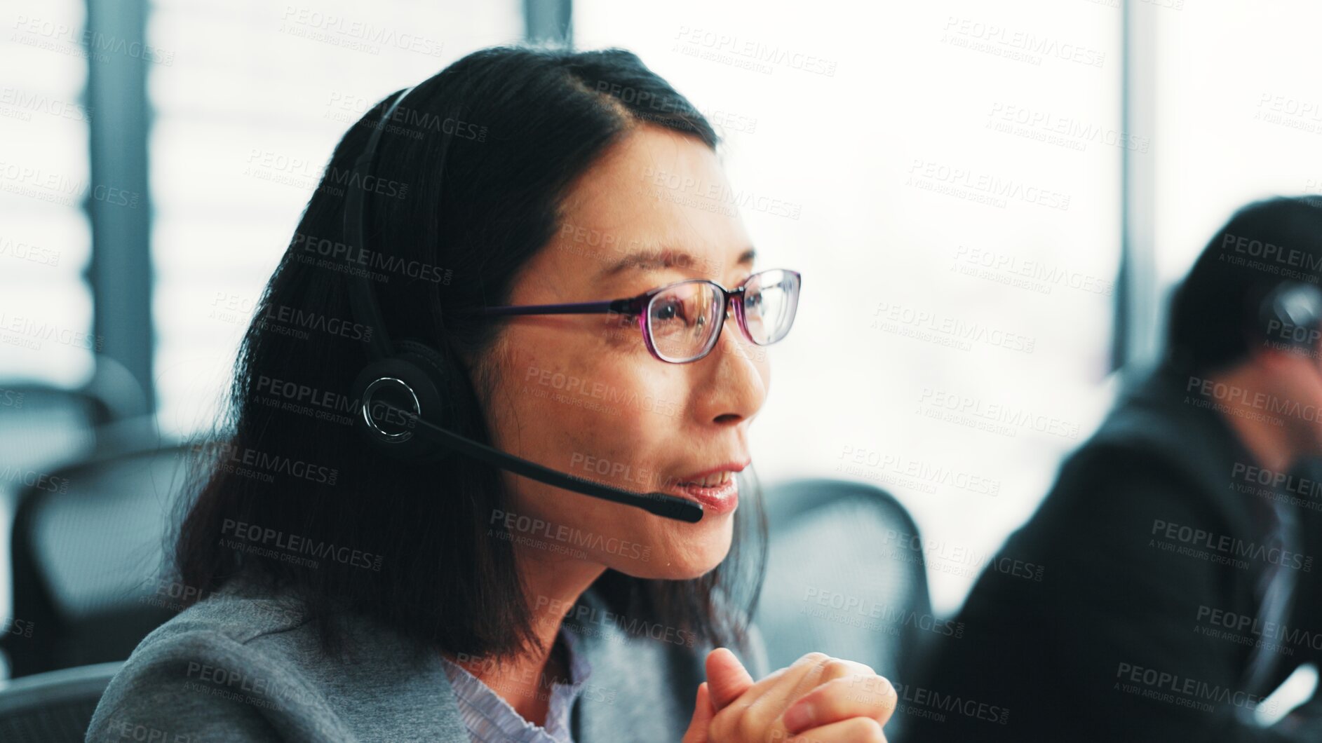 Buy stock photo Woman, telemarketing operator and customer support agent in office, talking and advisor to client. Female person, call centre representative and helping consumer with loan in Japan insurance agency