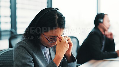 Buy stock photo Tired, headache and Japanese woman in call center with stress, burnout or fatigue in office. Sad Asian consultant, upset or frustrated sales agent in telemarketing company with depression or migraine