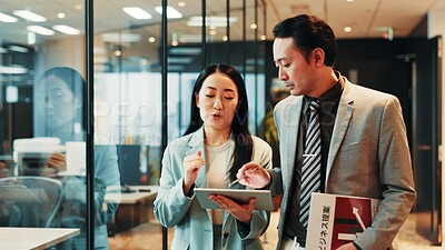 Buy stock photo Business, walking and people with tablet in office for signature on funding request application or proposal review. Accountant, employee and digital report for investment approval at Japanese firm