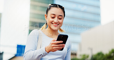 Buy stock photo Woman, smile and phone in city for social media, good news and student loan approval in Tokyo. Japanese girl, mobile and happy in town for scholarship opportunity, achievement and academic report