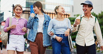 Buy stock photo Happy, asian students and walking with laugh in city for social, community or friendship at campus. Japan, young or group of friends in joy for funny chat, humor or joke at college or university