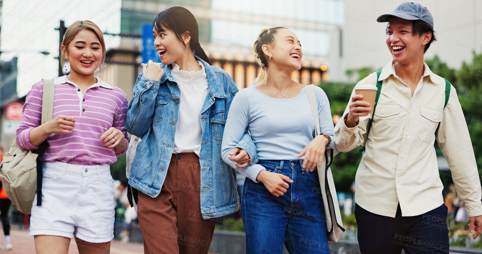 Buy stock photo Happy, asian students and walking with laugh in city for social, community or friendship at campus. Japan, young or group of friends in joy for funny chat, humor or joke at college or university