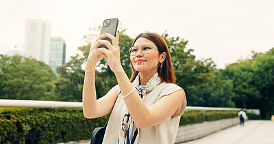 Buy stock photo Woman, travel and selfie with confident in city, memory and photography for post with app in nature. Person, smile and profile picture with inspiration, reflection and outdoor at park in Japan