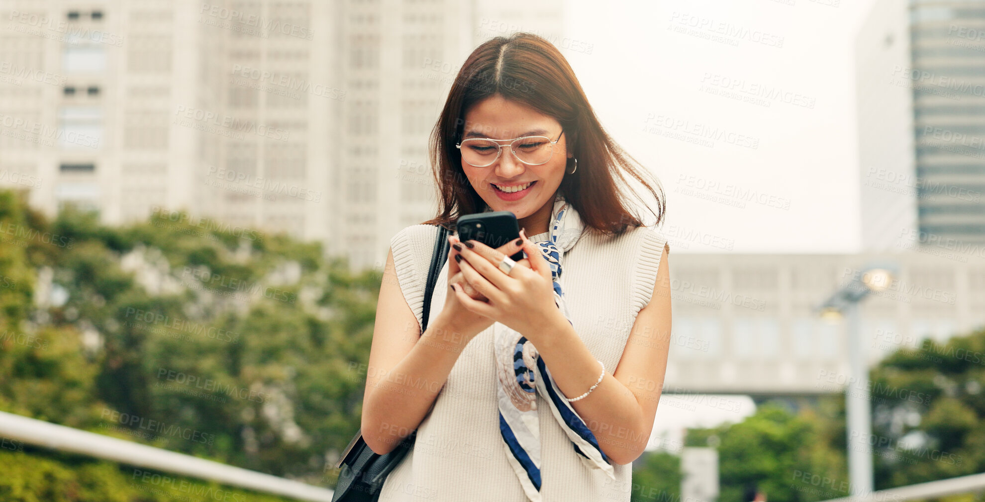 Buy stock photo Japan, typing and woman in city, smartphone and smile with connection, travel and internet. Asian person, outdoor or girl in street, mobile user or cellphone with social media, digital app or message