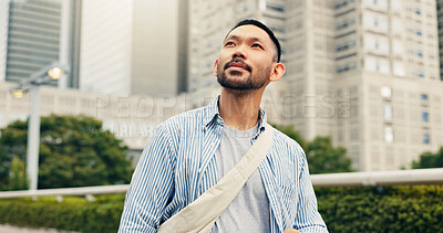 Buy stock photo Outdoor, travel and walking with man, buildings and tourism with journey, holiday and calm. Japanese person, tourist and guy with weekend break, commute and vacation with urban town or sightseeing