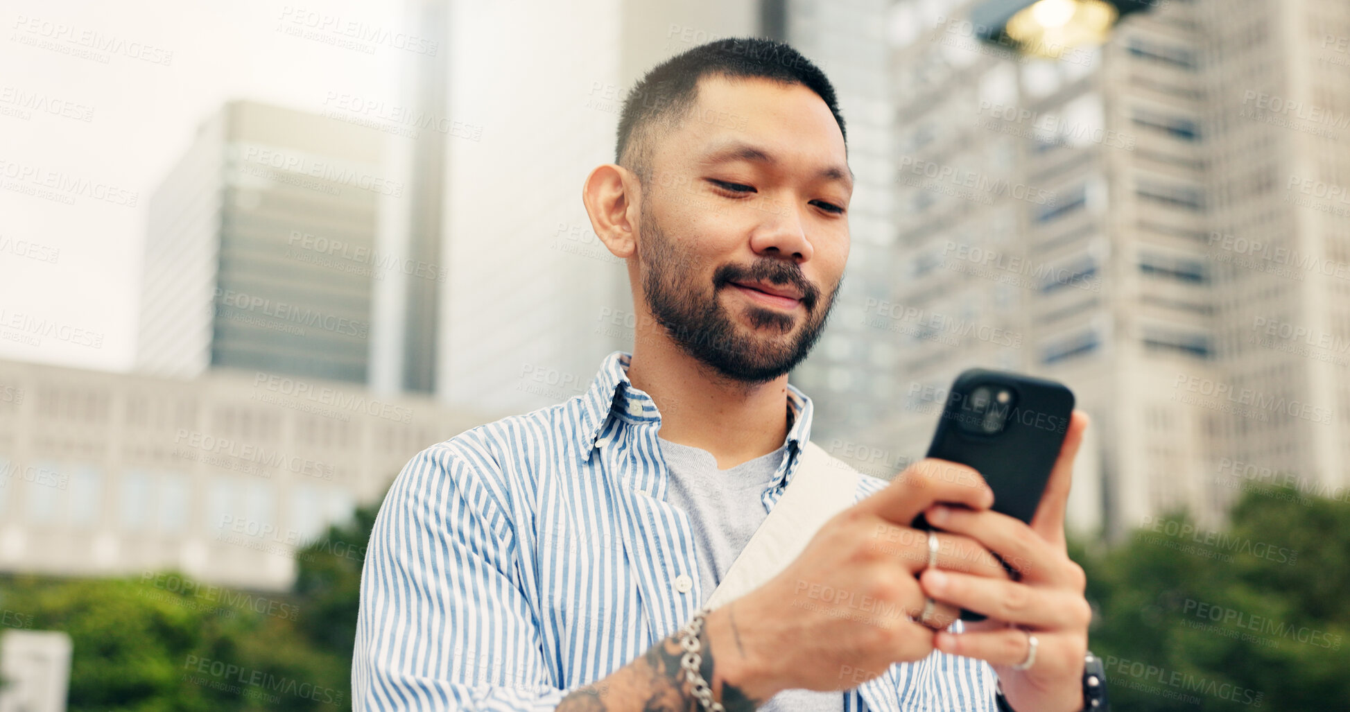 Buy stock photo Japan, typing and man in city, cellphone and smile with connection, travel and internet. Asian person, outdoor and guy in street, communication or smartphone with social media or message to contact