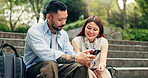 Couple, smartphone and travel on stairs at park with search for location, direction and booking for hotel on mobile app. People, man and woman with phone, reading and smile for notification in Japan