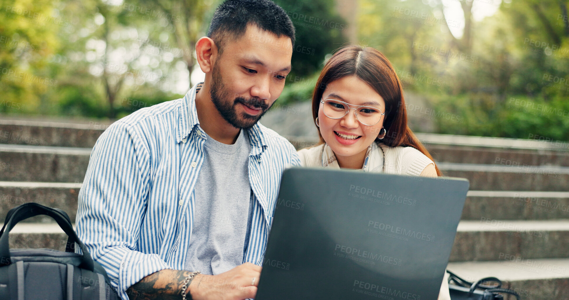 Buy stock photo Laptop, man and woman on outdoor stairs with research, planning and teamwork meeting in Japan. Search, collaboration and business people on steps together for online report, review or website in park