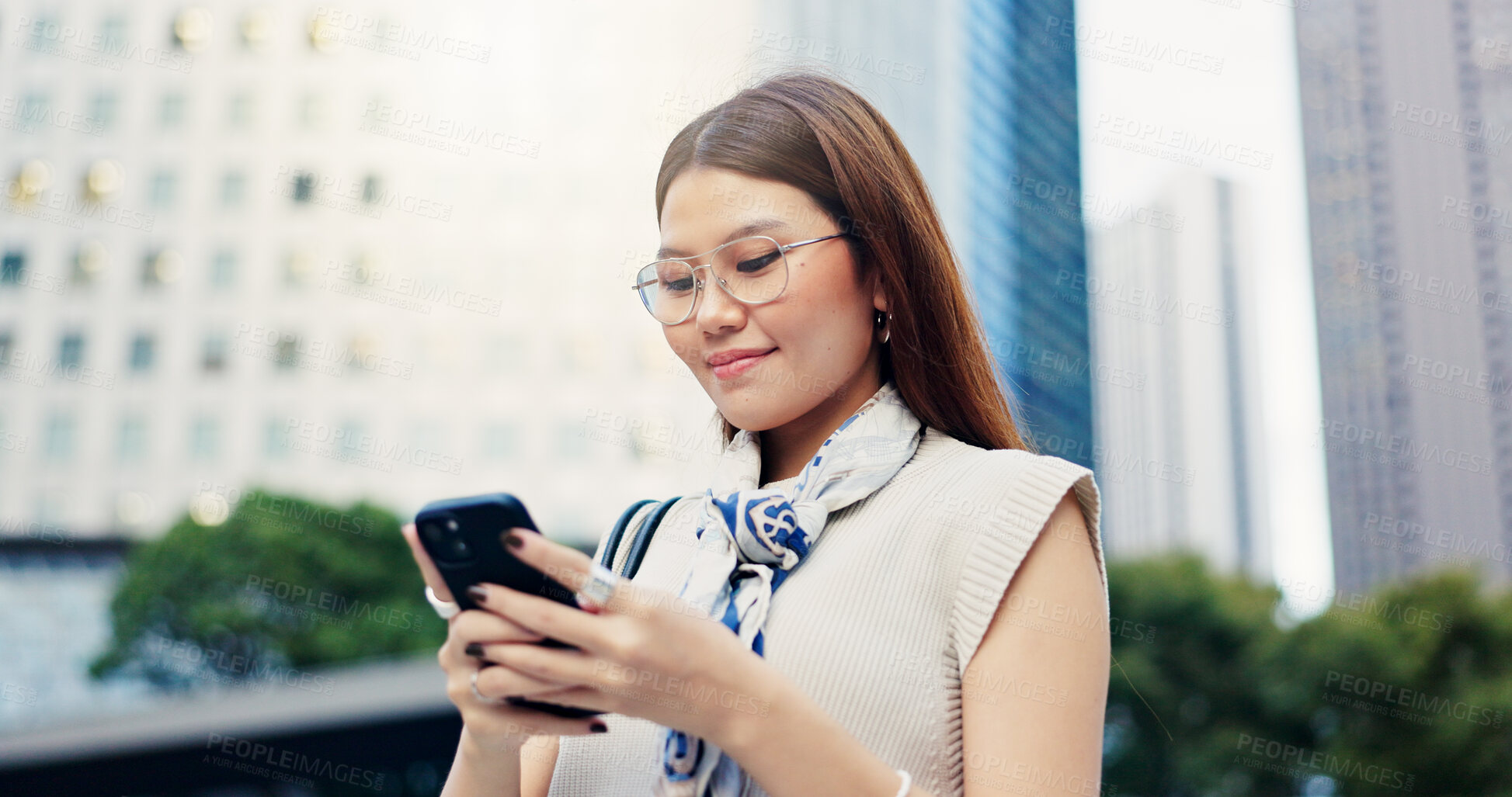 Buy stock photo Japan, typing and woman in city, cellphone and smile with connection, travel and internet. Asian person, outdoor and girl in street, urban town or smartphone with social media or message to contact