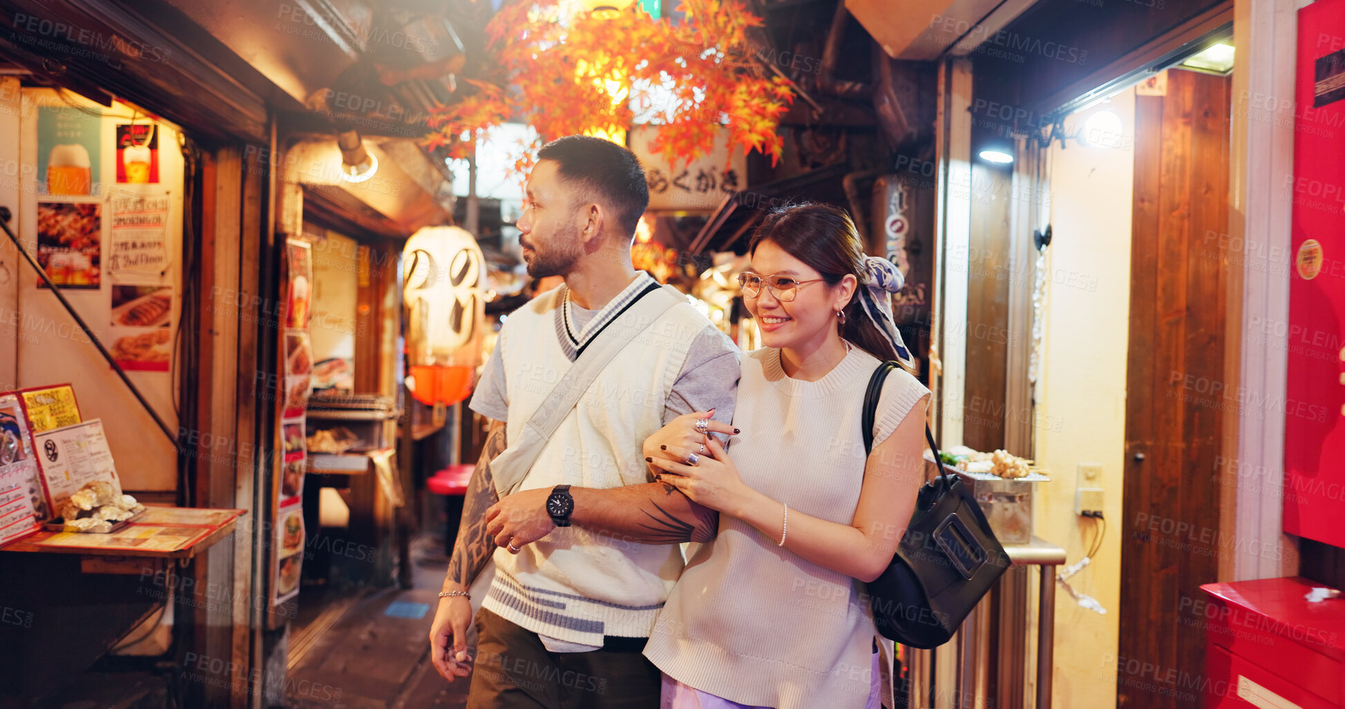 Buy stock photo Couple, city and walking at night market in Japan, love and bonding on honeymoon vacation. People, security and outdoor support on holiday in town, travel together and explore culture or sightseeing