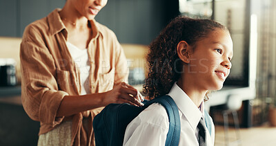 Buy stock photo Mom, girl and happy with backpack in home for preparing or ready for elementary education. Apartment, people and parent with kid in uniform for first day at school with smile, pride and child growth