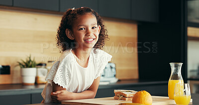 Buy stock photo Child, smile and portrait in home with breakfast, orange juice or relax in morning. Young girl, sandwich or happy in kitchen with food, fresh drink or nutrition with vitamin C for development in Cuba