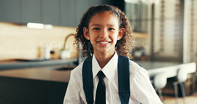 Buy stock photo Portrait, happy child and student with school uniform in home for learning and start education in kitchen. Face, smile and girl in elementary for first day, growth and ready for knowledge in Brazil