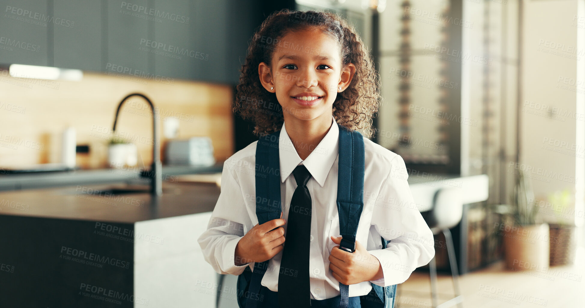 Buy stock photo Portrait, happy kid and student with school uniform in home for learning, education or study in kitchen. Face, smile or girl child in elementary for first day, growth or ready for knowledge in Brazil