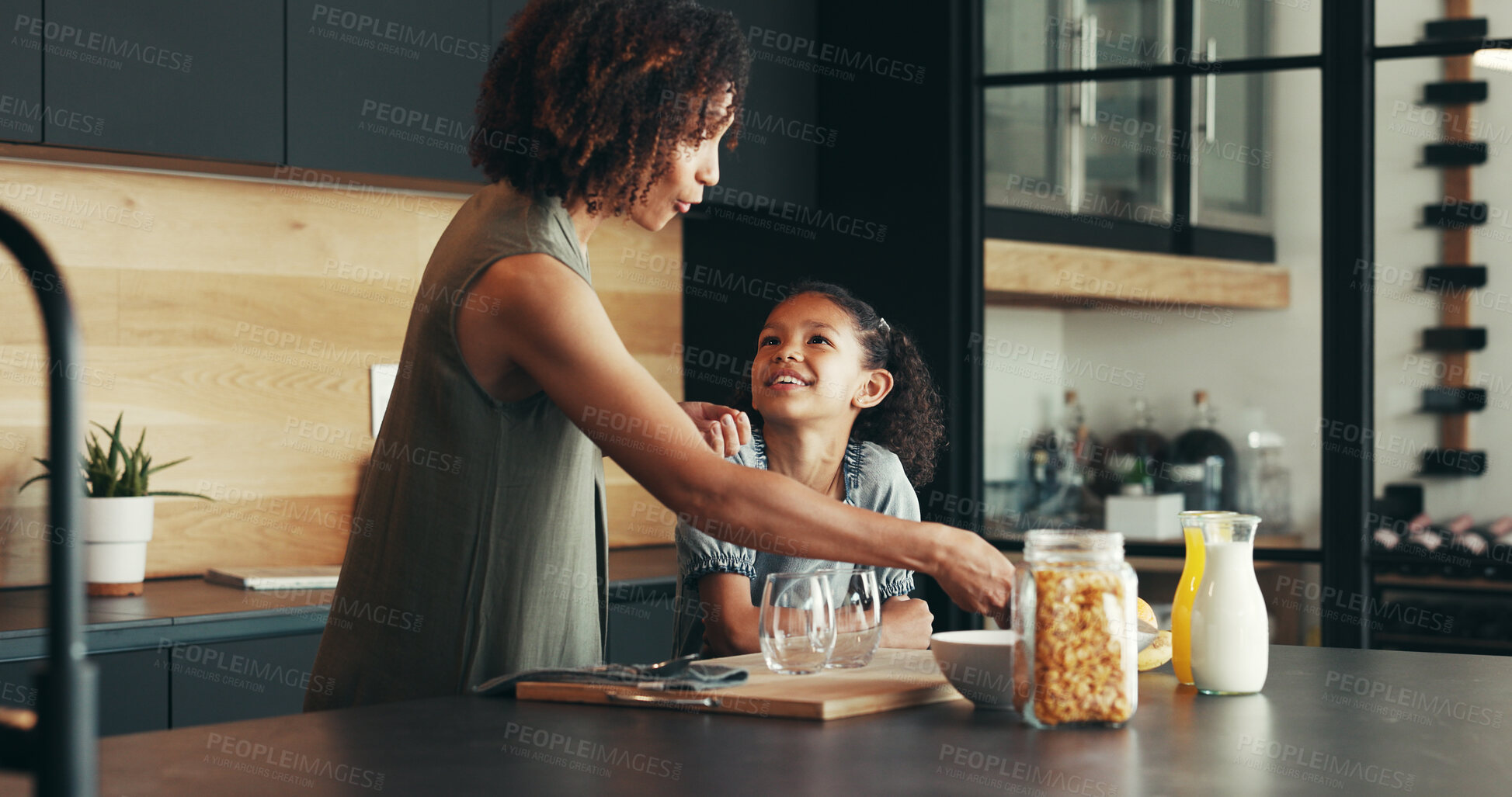 Buy stock photo Child, happy mother and cooking breakfast in kitchen, cereal and talking in family home. Mom, hungry kid and prepare food, help and parent serve healthy morning meal for nutrition, diet and learning