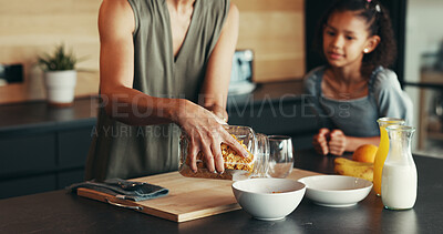 Buy stock photo Hands, child and mother with breakfast cereal, hungry and cooking for health in home. Mom, kid and prepare food in kitchen, help and parent pouring organic morning meal for nutrition, diet and growth