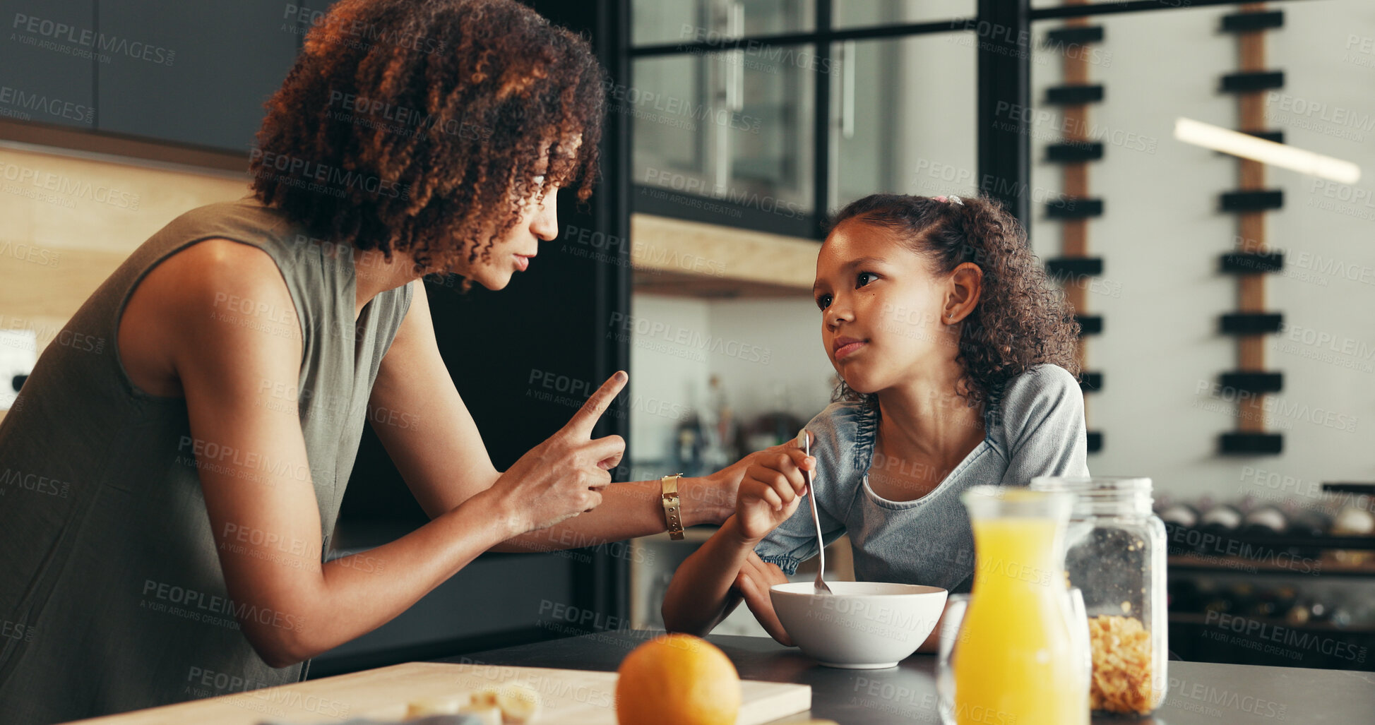 Buy stock photo Breakfast, teaching or mom talking to child for love, development or warning for lesson in morning. Girl, mother or kid eating cereal in family house kitchen for food, meal or nutrition for wellness