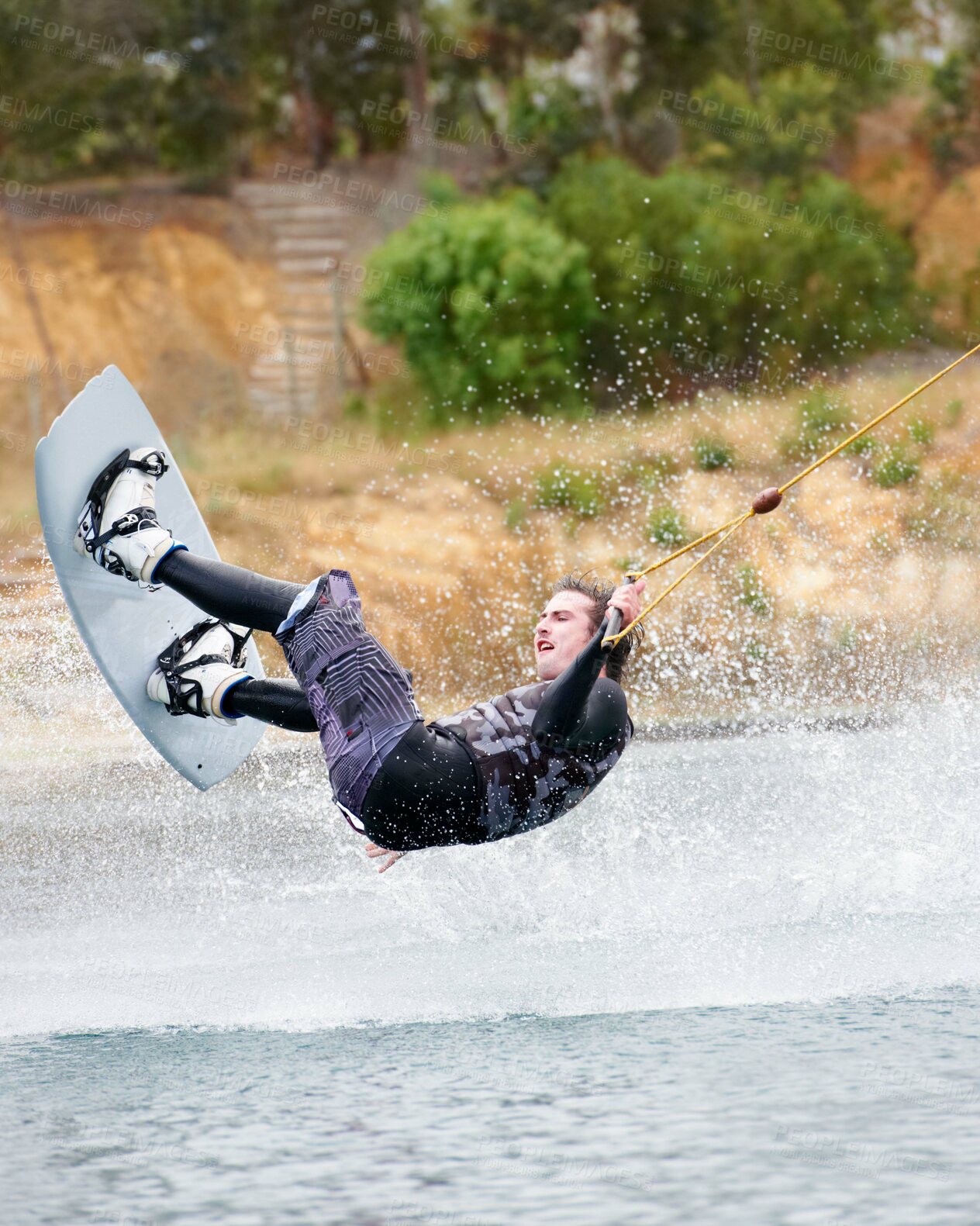 Buy stock photo Jump, wakeboarding and adventure, man on lake with outdoor fun, fitness and wave splash. Balance, water sports and person on river with freedom, speed and energy for surfing challenge, ski and trick