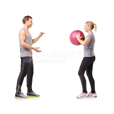 Buy stock photo Couple in studio with fitness, gym ball and coaching for exercise, body wellness and advice. Sports workout, man and woman with sphere for balance, training and personal trainer on white background.