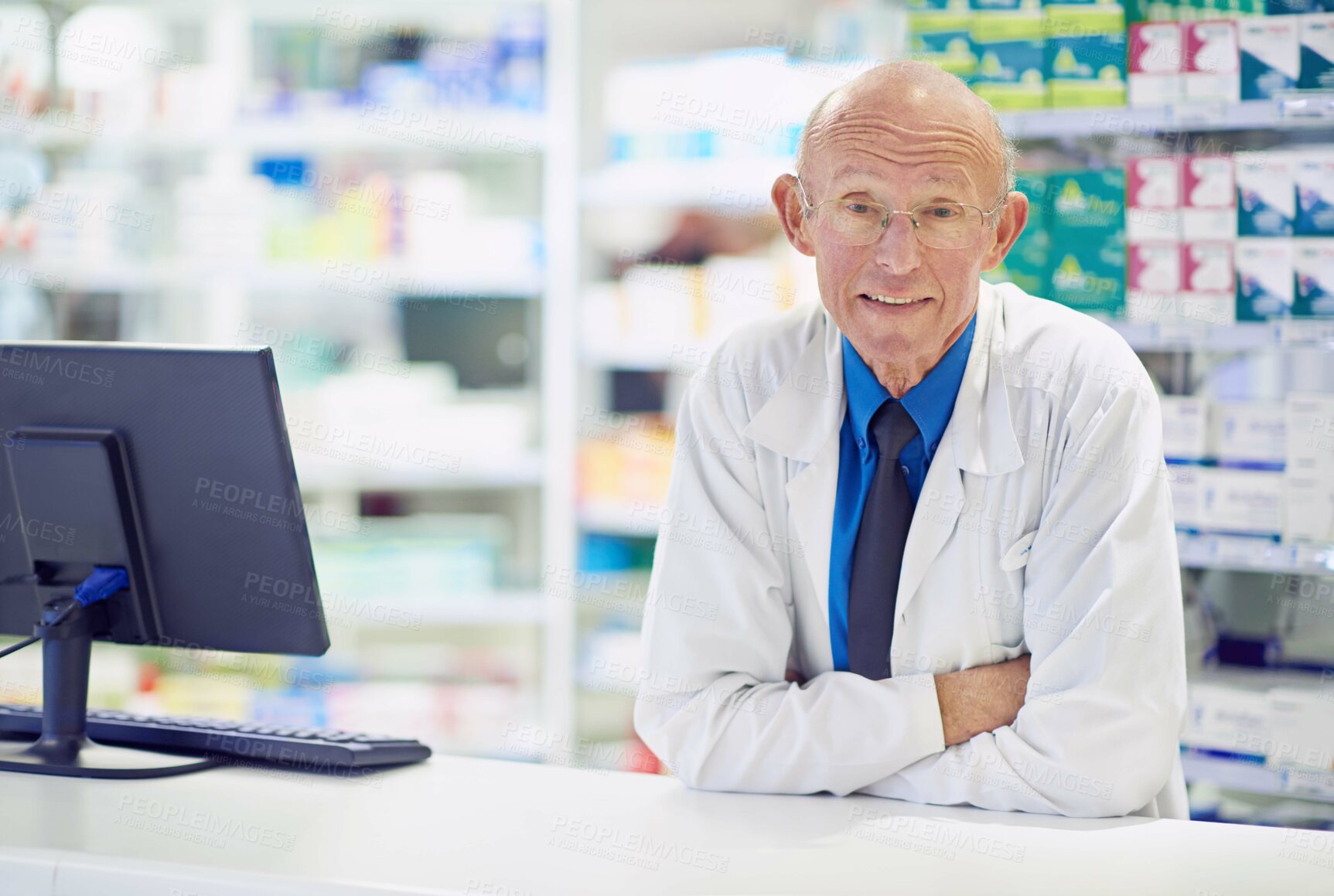 Buy stock photo Portrait of a senior pharmacist working at a counter 