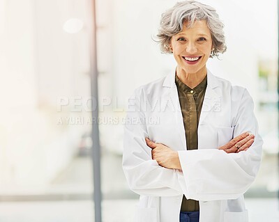 Buy stock photo Portrait of a confident and mature doctor folding her arms