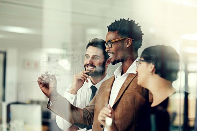 Buy stock photo Cropped shot of a group of businesspeople brainstorming with notes on a glass wall in an office